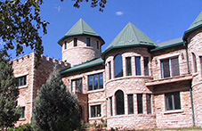 Side view of the Castle house, with Colorado buff stone facade. Loveland, Colorado.